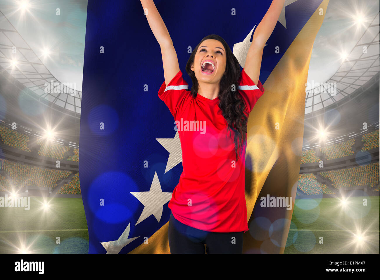 Composite image of cheering football fan in red holding bosnian flag Stock Photo