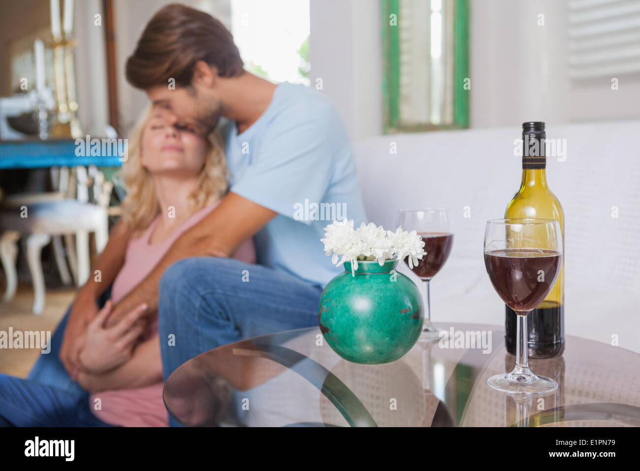 Cute couple drinking red wine Stock Photo - Alamy