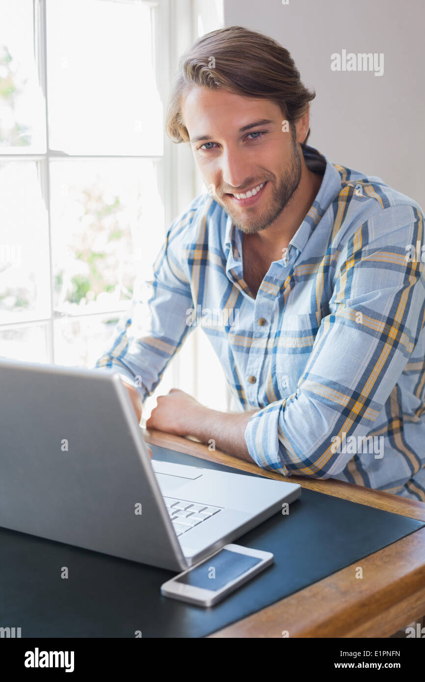 Adult man laptop looking camera hi-res stock photography and images - Alamy