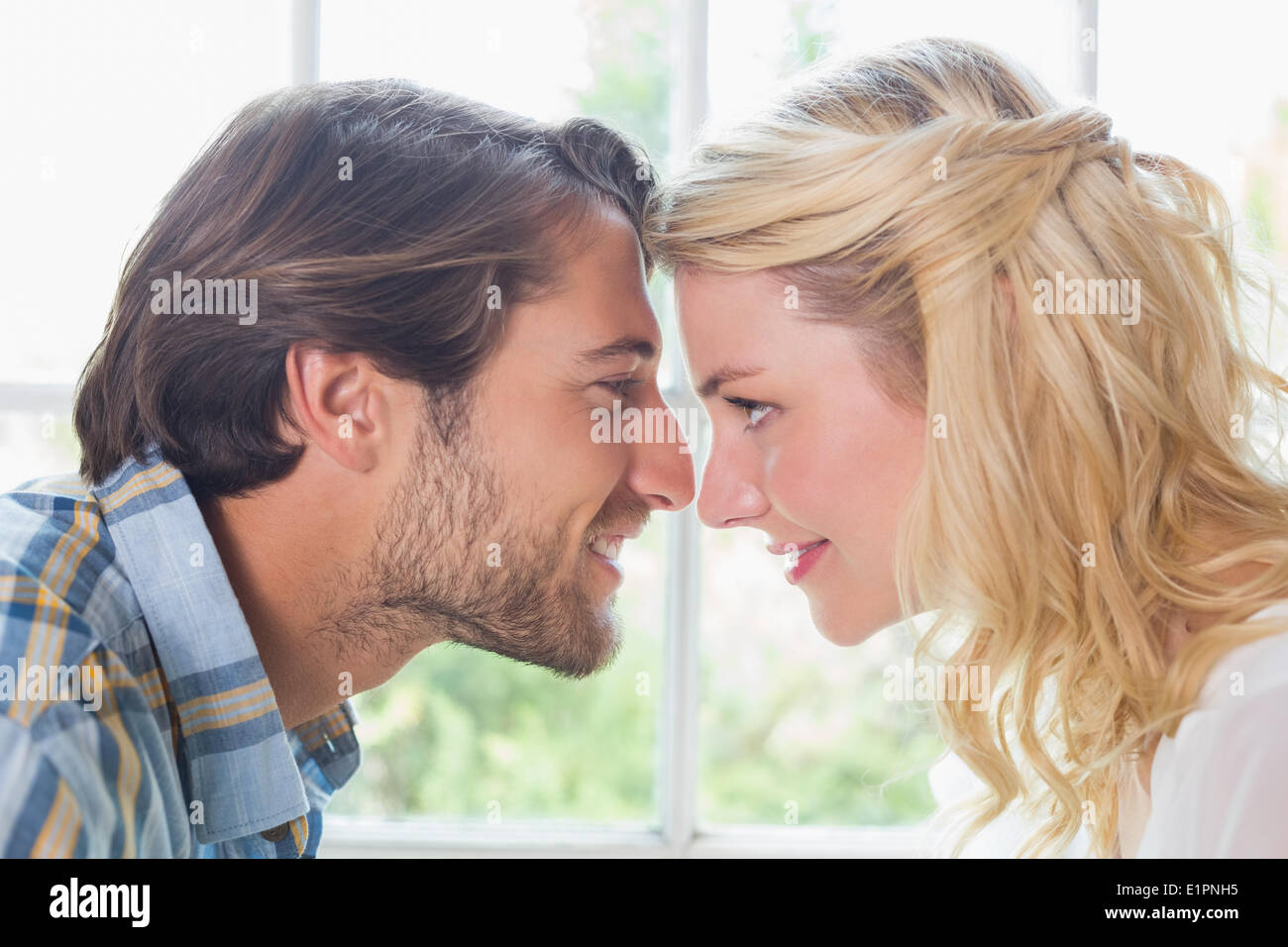 Cute affectionate couple facing each other Stock Photo