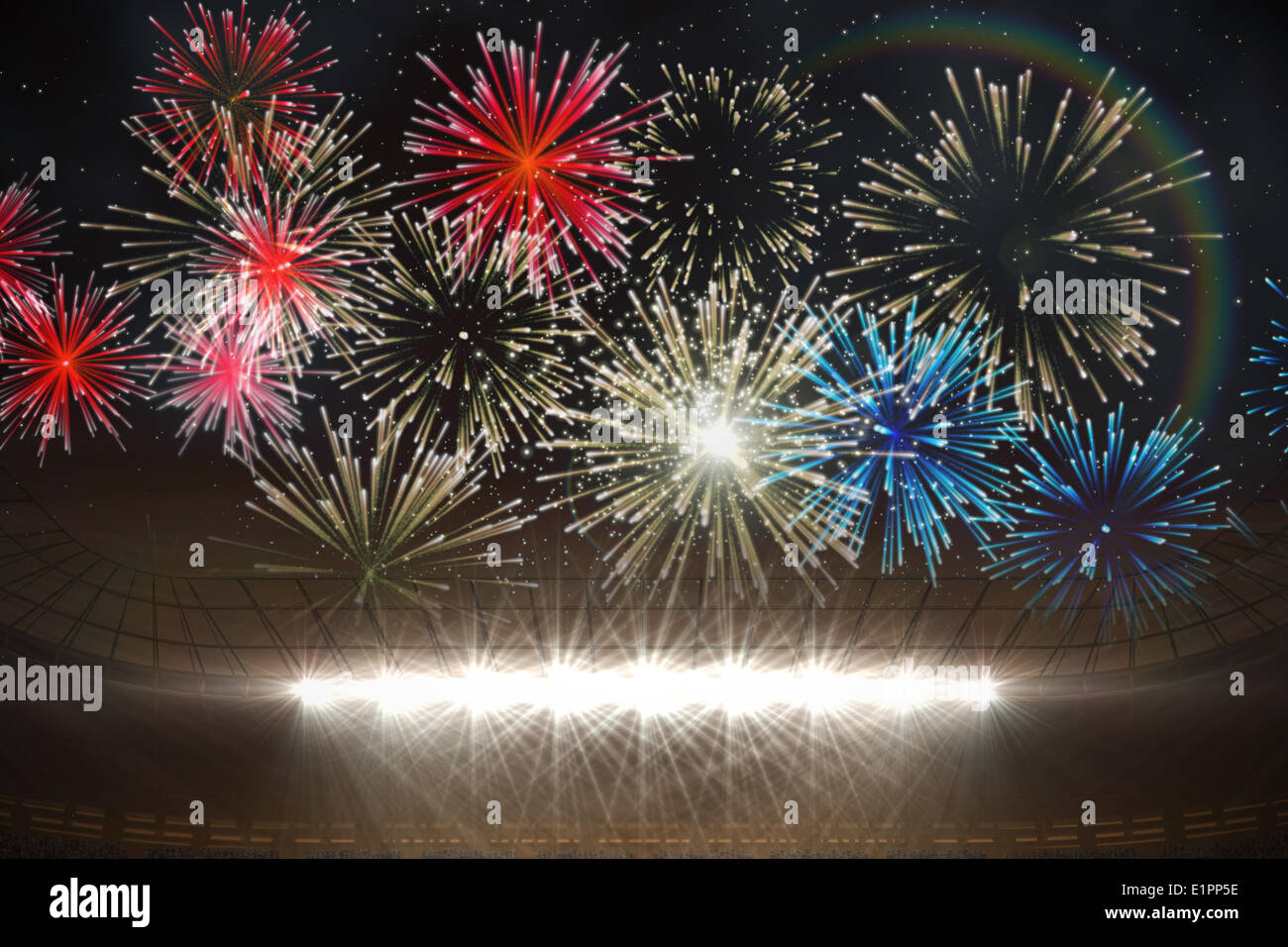 Fireworks exploding over football stadium Stock Photo