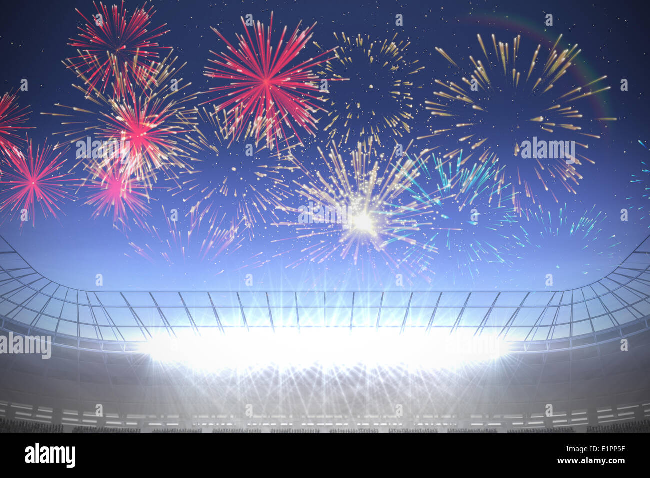 Fireworks exploding over football stadium Stock Photo