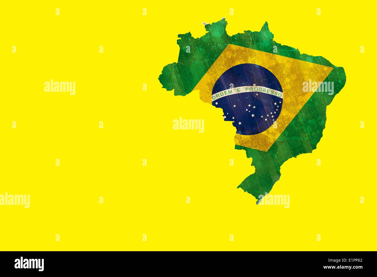 Green brazil outline with flag on yellow Stock Photo
