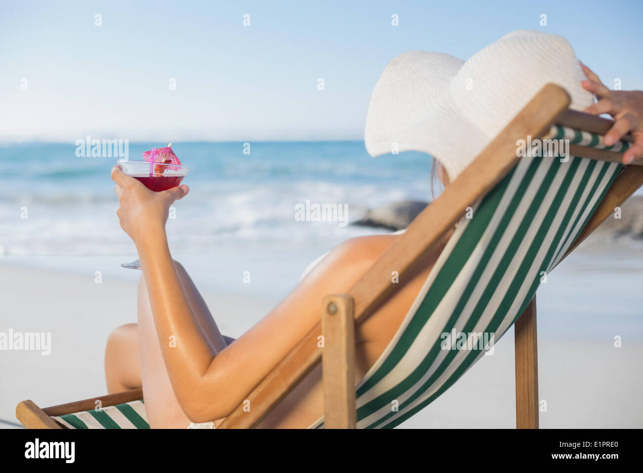 Woman drinking cocktail beach chair hi-res stock photography and images image