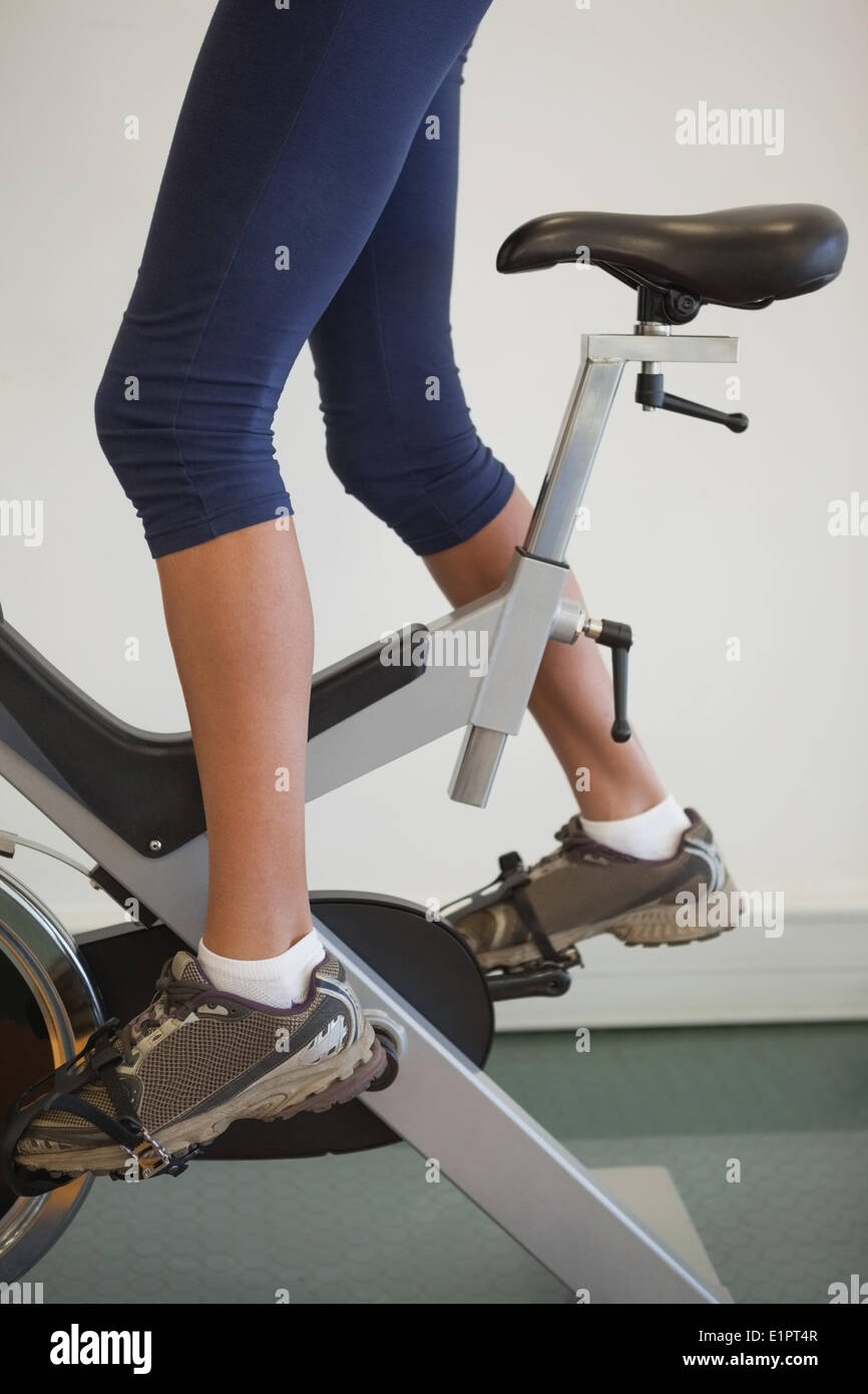 Fit woman on the spin bike Stock Photo