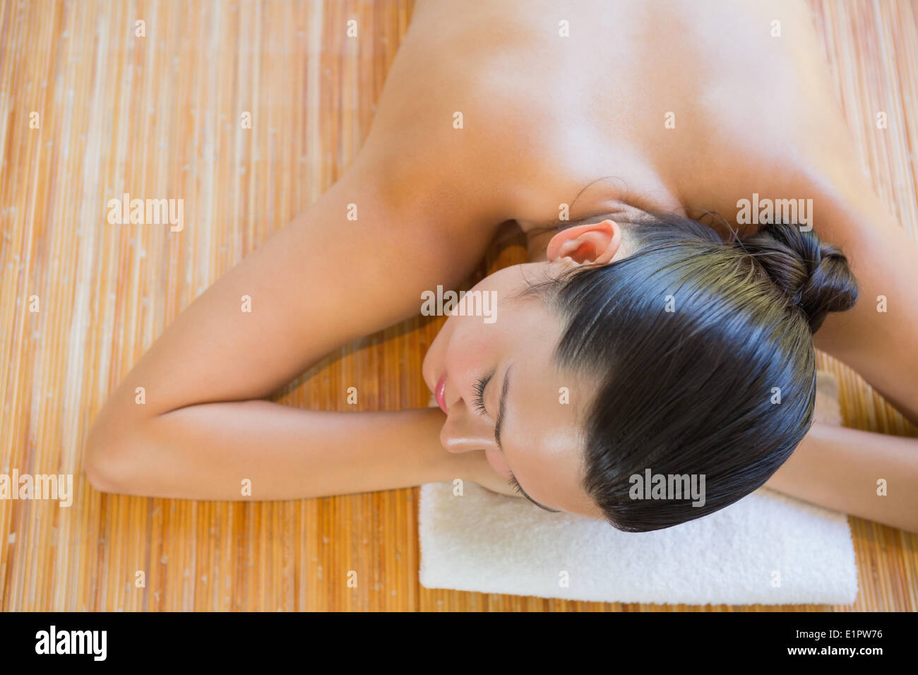 Content brunette relaxing on massage table Stock Photo