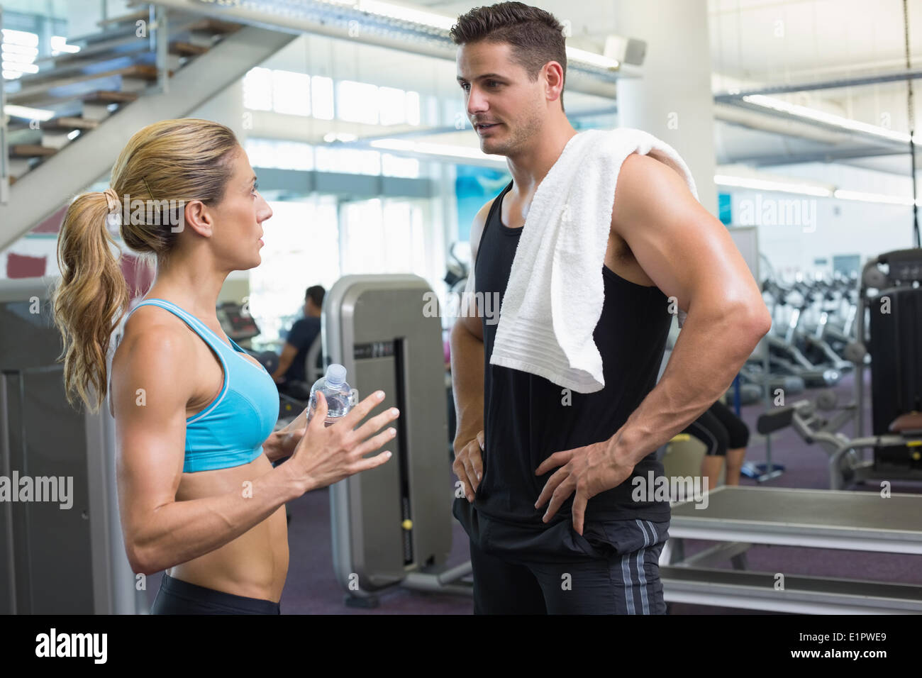 Bodybuilding man and woman talking together Stock Photo