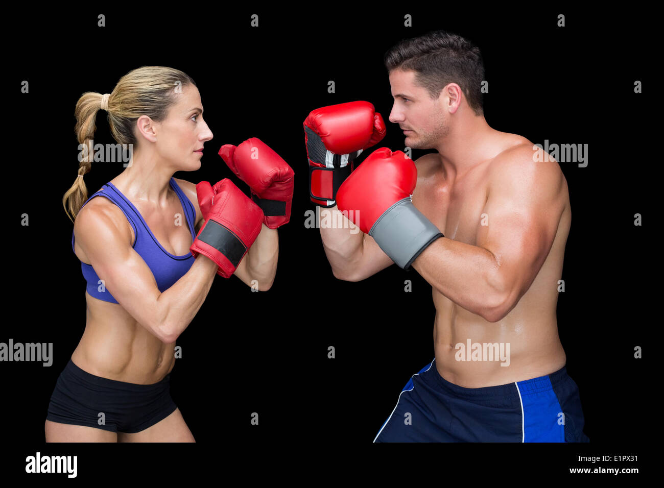 Bodybuilding couple posing with boxing gloves Stock Photo Alamy