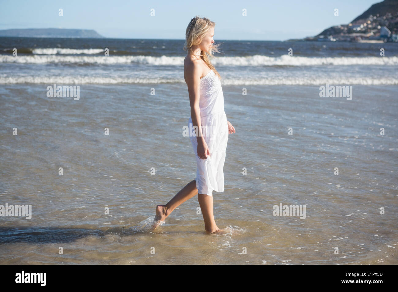 Woman in white dress walking hi-res stock photography and images - Alamy