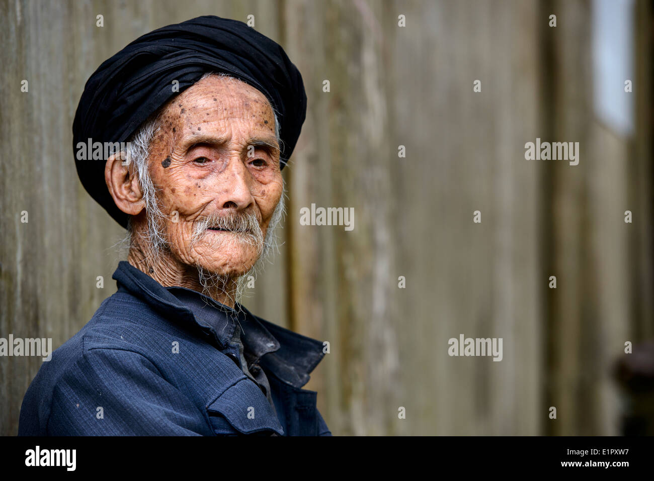An elderly member of the Yao minority people in Tiantou Village, Guangxi, China. Stock Photo