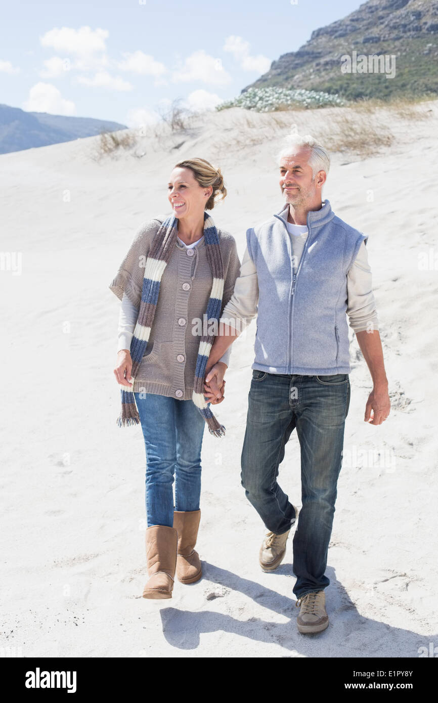 Woman on beach holding hands hi-res stock photography and images - Alamy