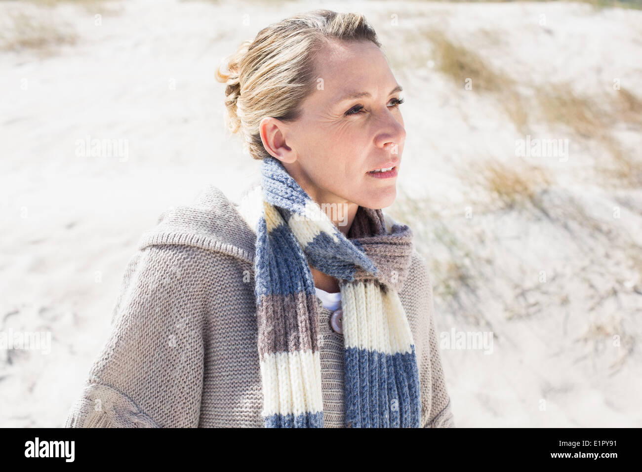 Attractive blonde standing on the beach Stock Photo - Alamy