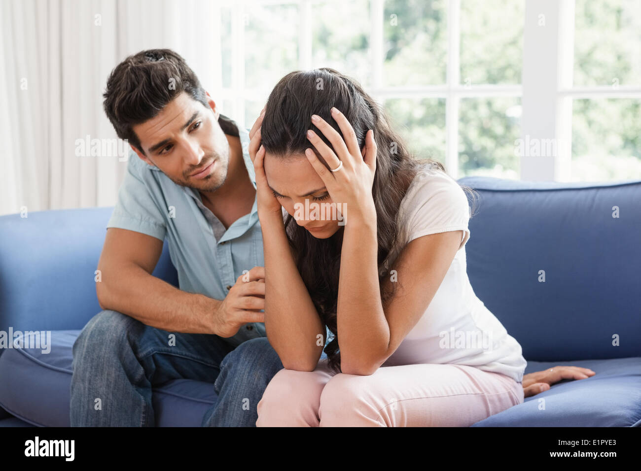 Man comforting his upset partner Stock Photo Alamy