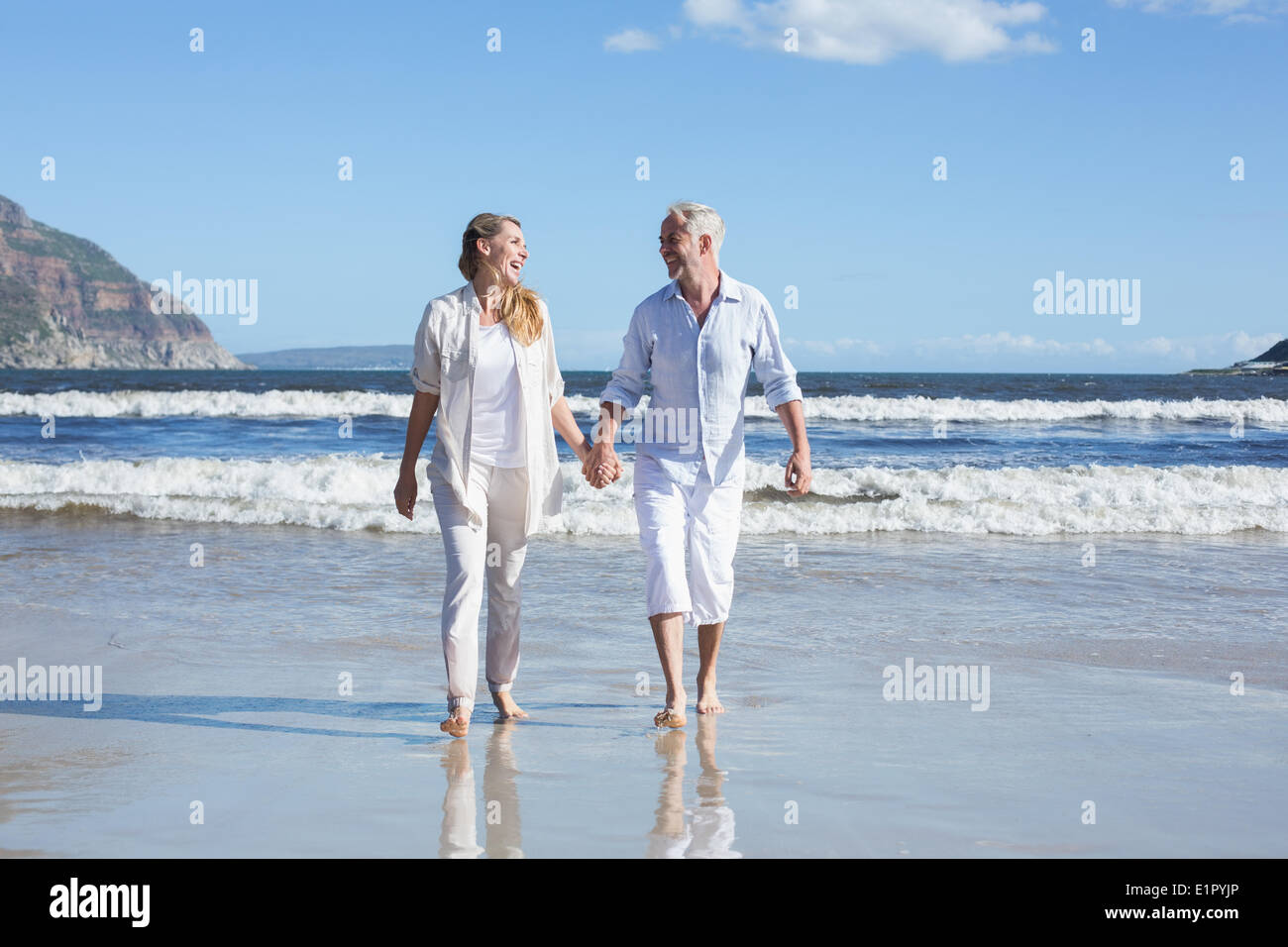 Mature couple walking hand in hi-res stock photography and images - Alamy