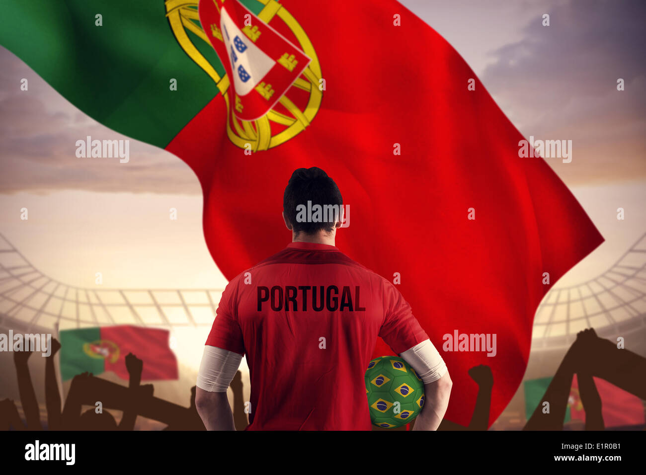 Composite image of portugal football player holding ball Stock Photo