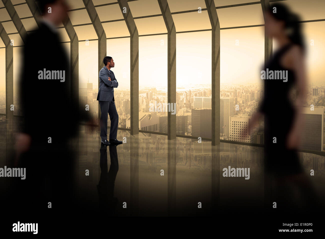 Composite image of business people walking in a blur Stock Photo - Alamy