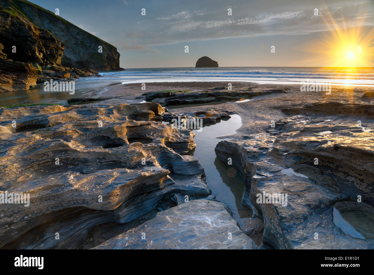 Rock pools at low tide on the beach at Trebarwith Strand on the north