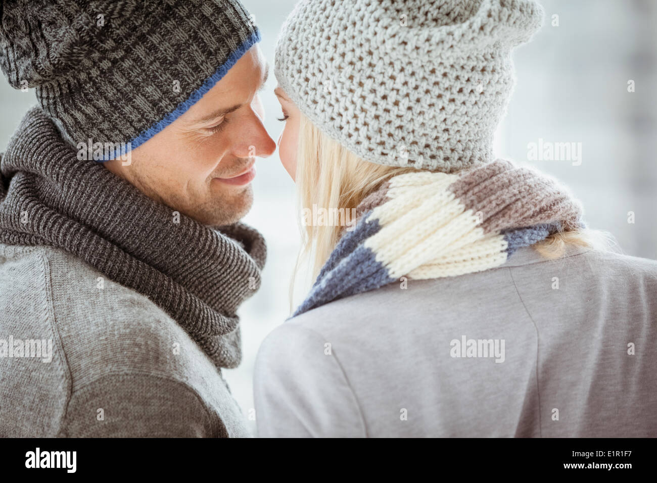 Couple in warm clothing facing each other Stock Photo