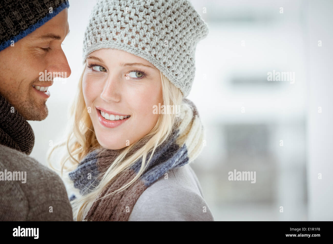 Couple in warm clothing hugging Stock Photo