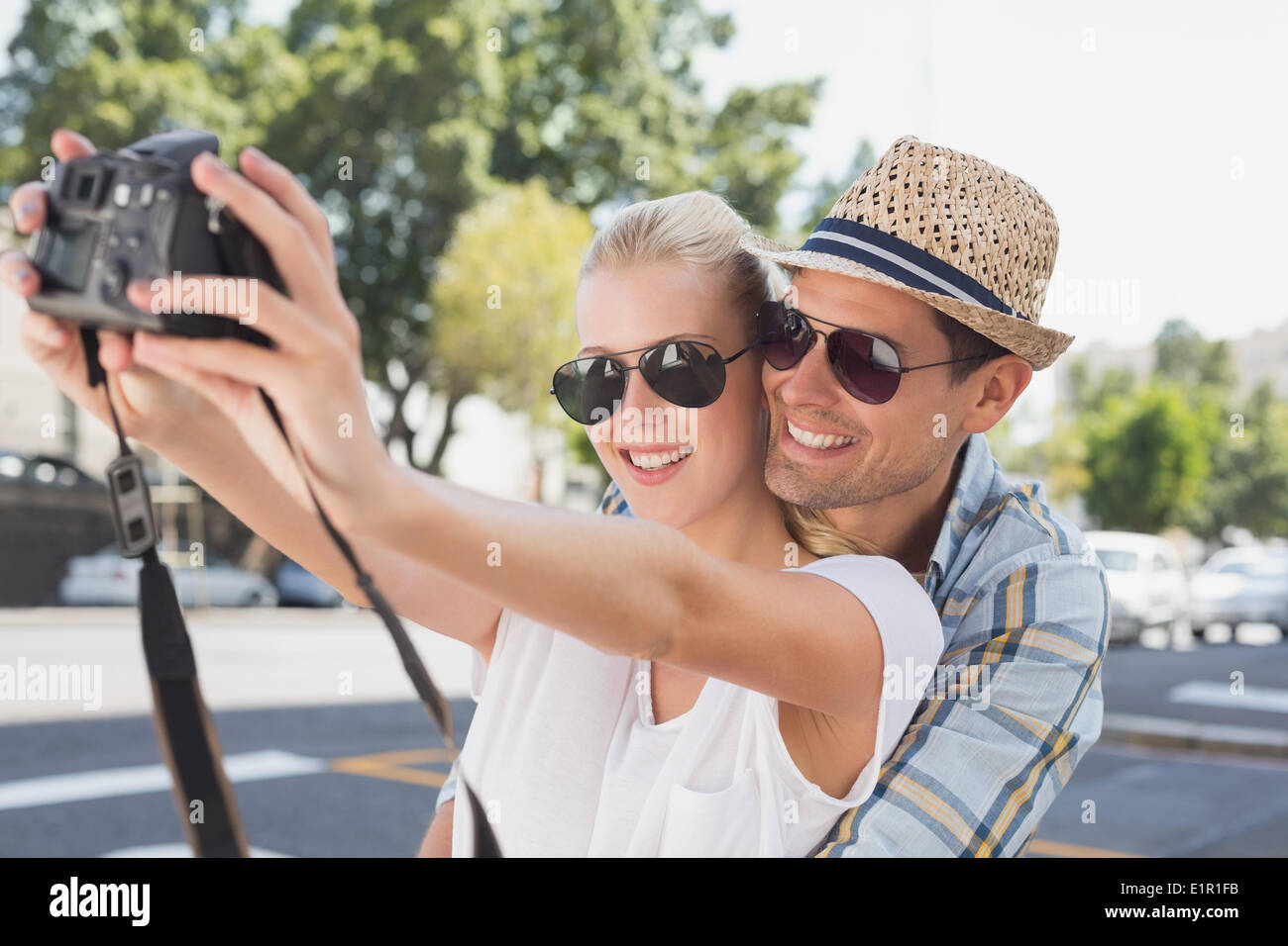 Young hip couple taking a selfie Stock Photo