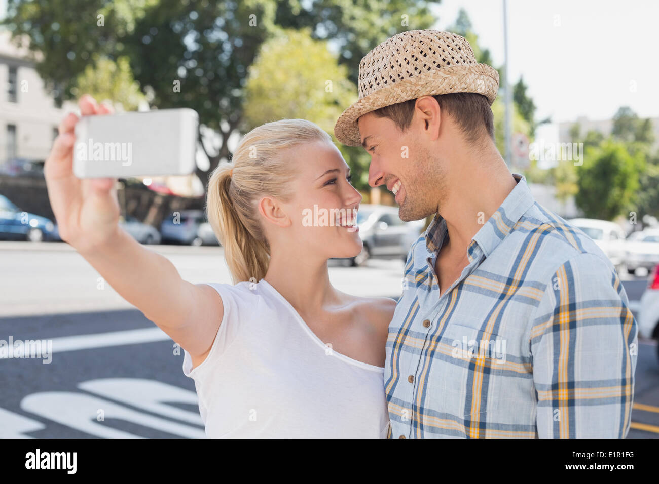 Young hip couple taking a selfie Stock Photo
