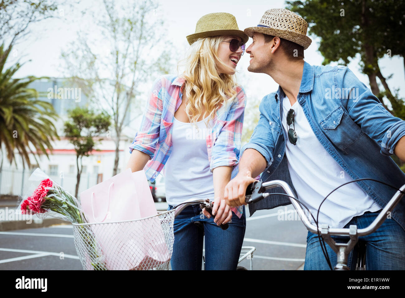 Hip young couple on a bike ride Stock Photo