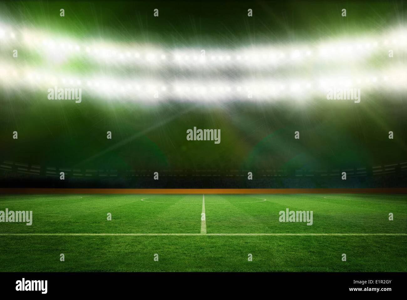 Football pitch under green lights Stock Photo - Alamy