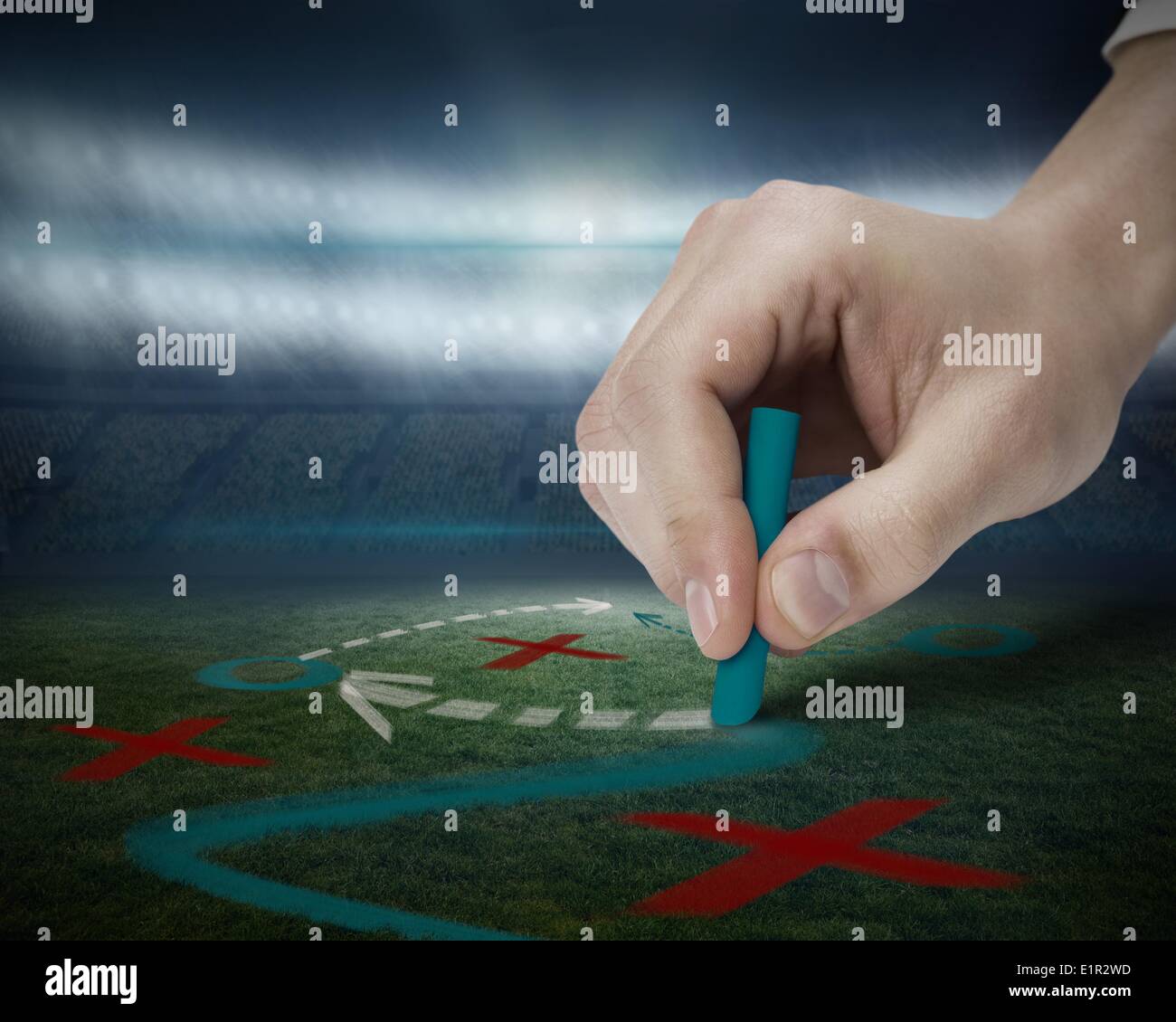 Hand drawing tactics on football pitch Stock Photo