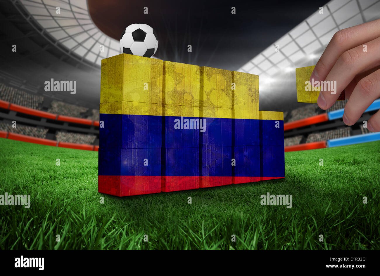 Composite image of hand building wall Stock Photo