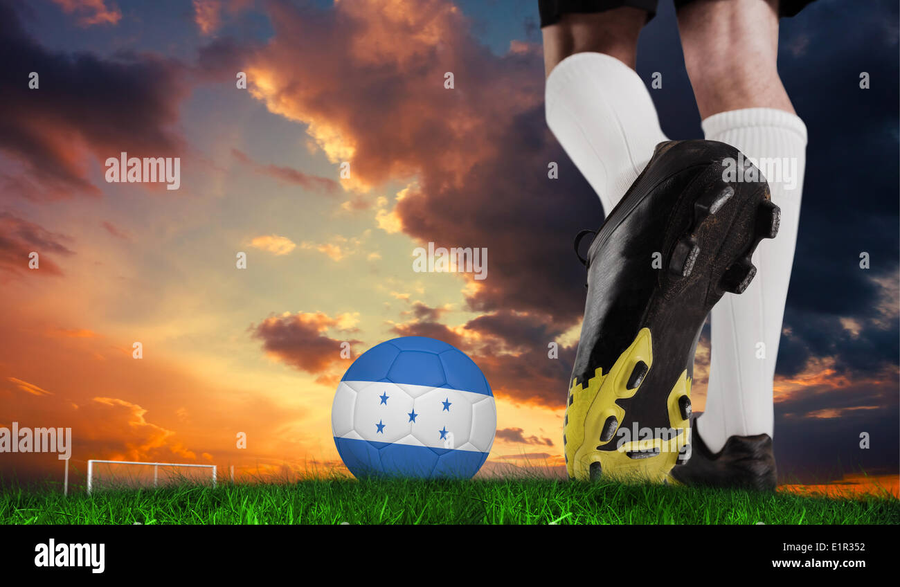 Composite image of football boot kicking honduras ball Stock Photo