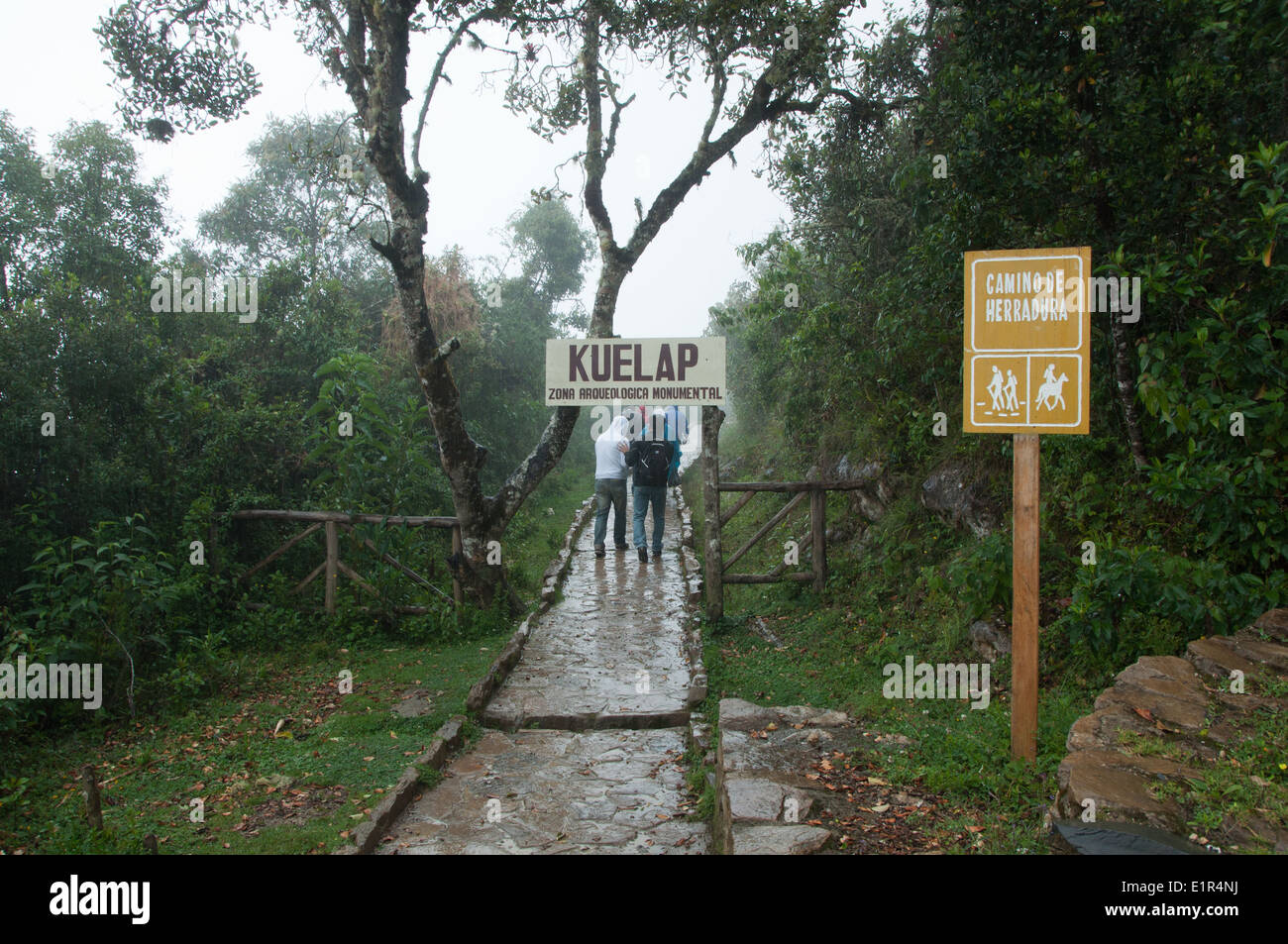 Visitors in the rain Entering the Kuelap Archaelogical Zone in Chachapoyas Norther Peru Stock Photo
