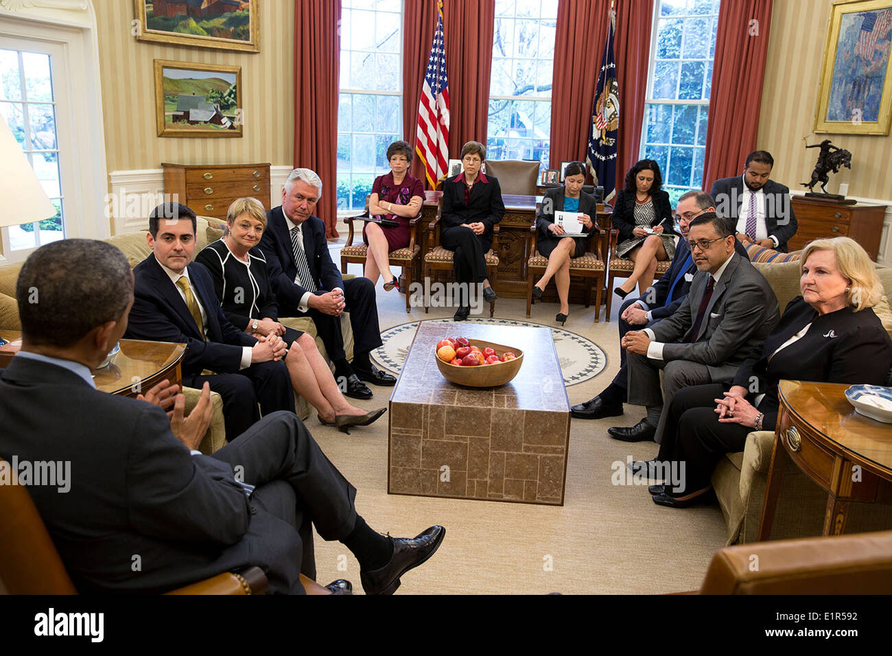 US President Barack Obama meets with faith leaders to discuss immigration reform in the Oval Office of the White House April 15, 2014 in Washington, DC. Stock Photo