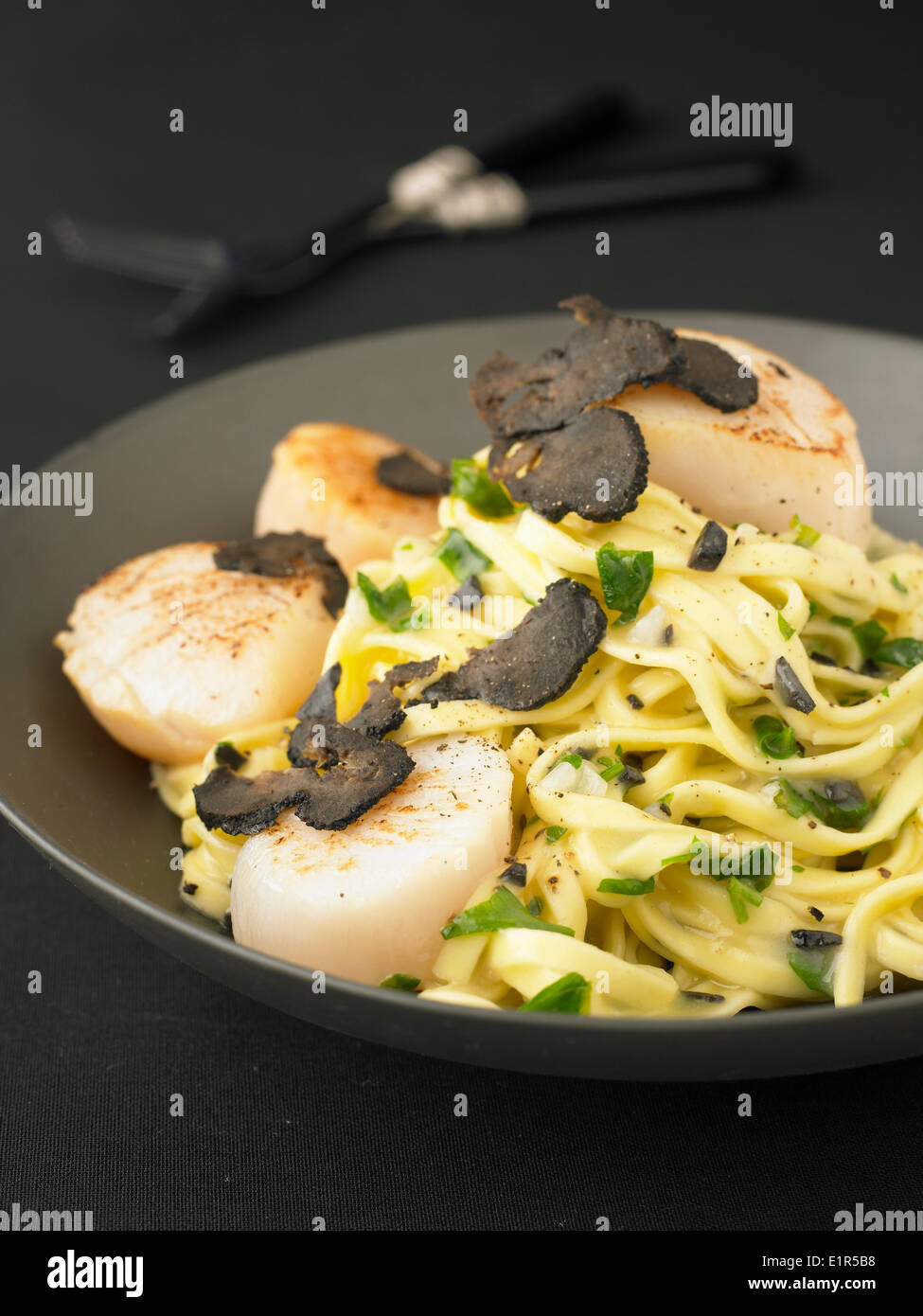 Pasta with scallops and truffles Stock Photo