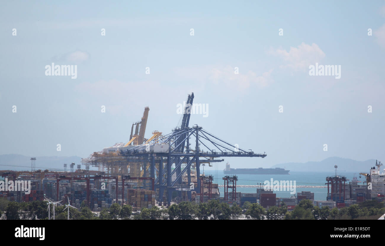 Crane for lifting cargo in container port in high view. Stock Photo