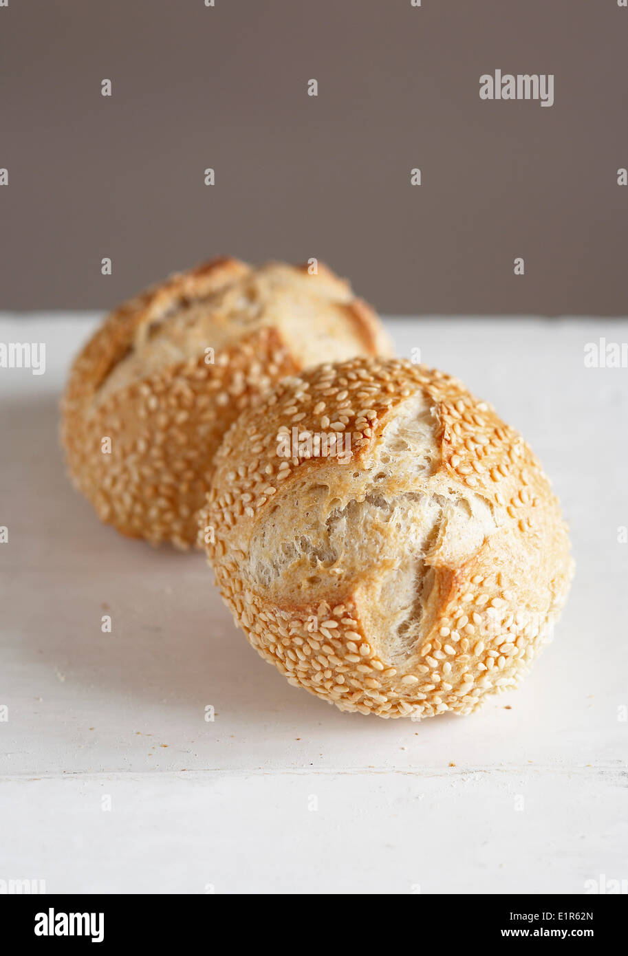 Two small sesame seed bread buns Stock Photo Alamy