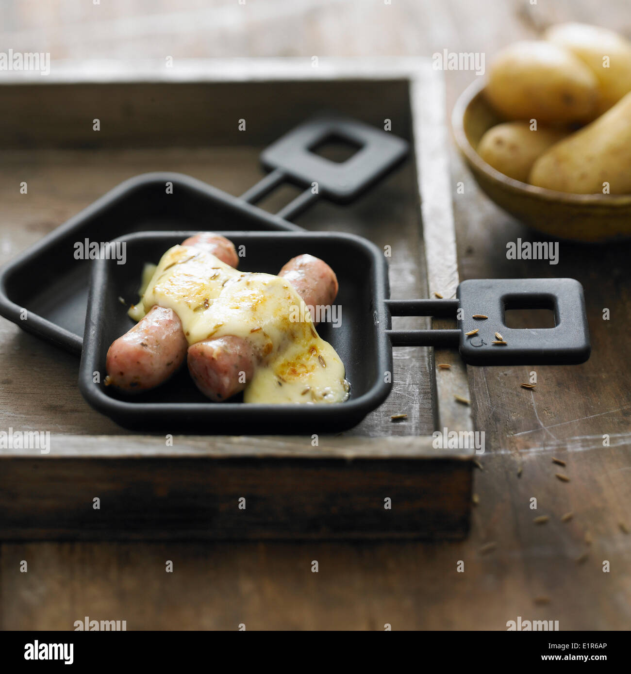 Sausages with cumin Raclette Stock Photo