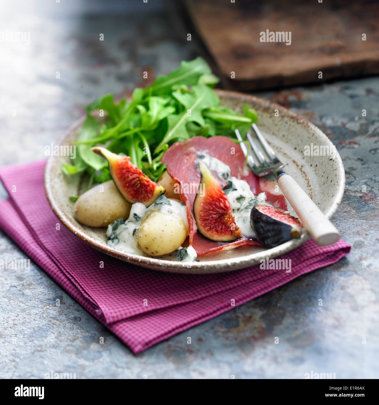 Gorgonzola Raclette with coppa,figs and potatoes Stock Photo