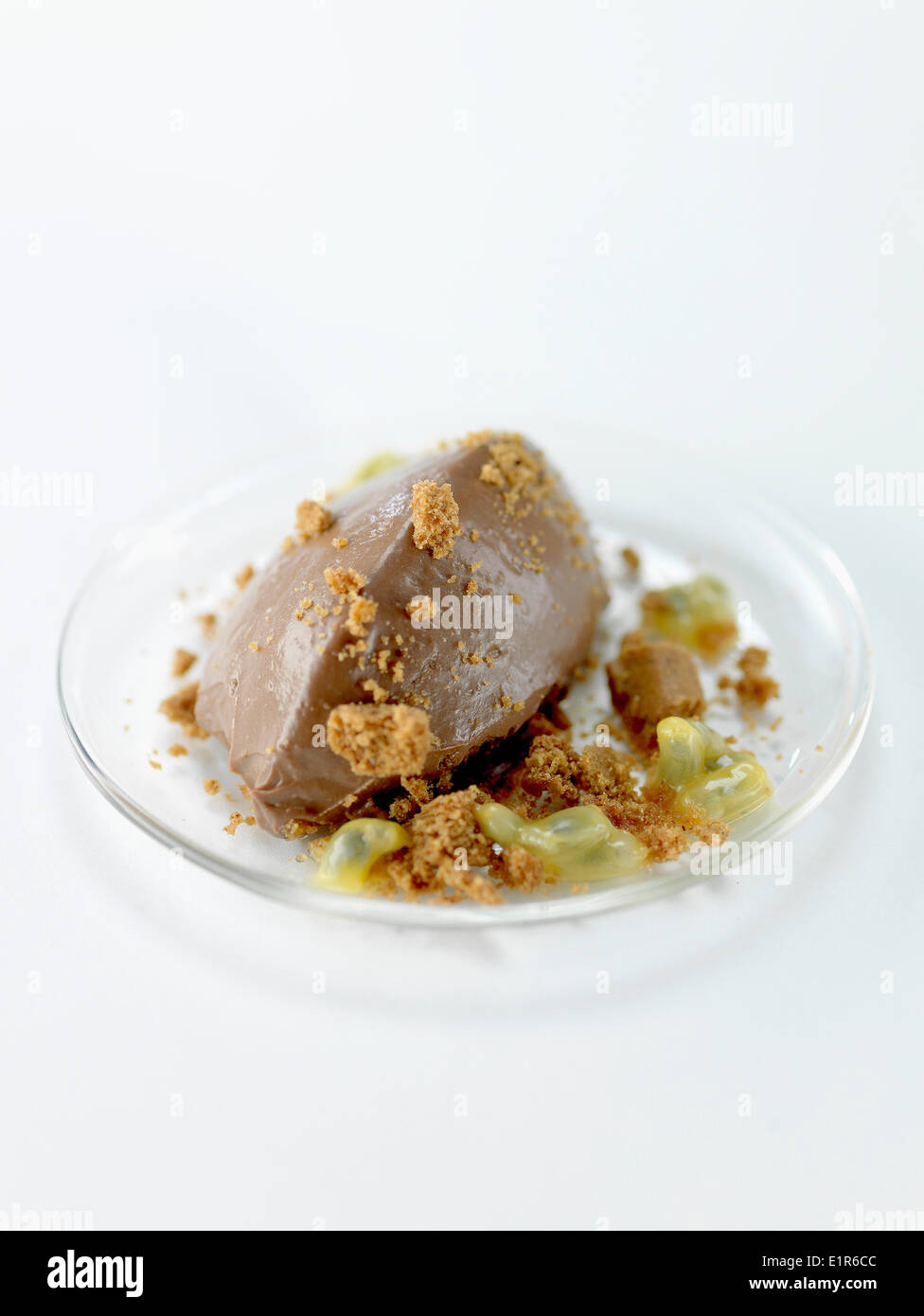 Chocolate cream quenelle with crushed Spéculos biscuits Stock Photo