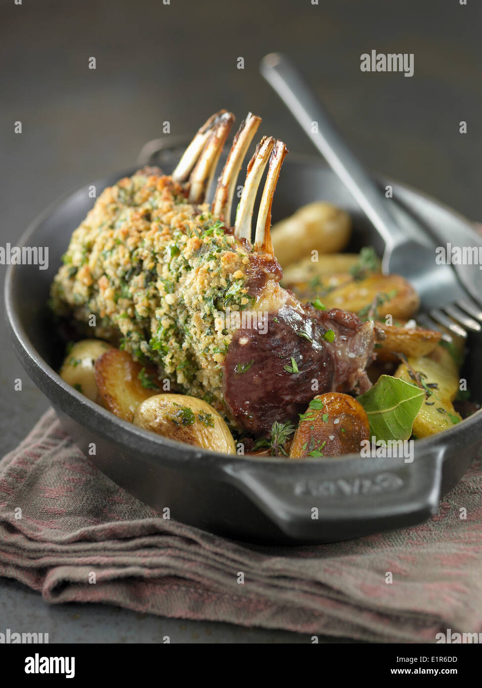 Loin of lamb in herb crust with Grenaille potatoes Stock Photo Alamy