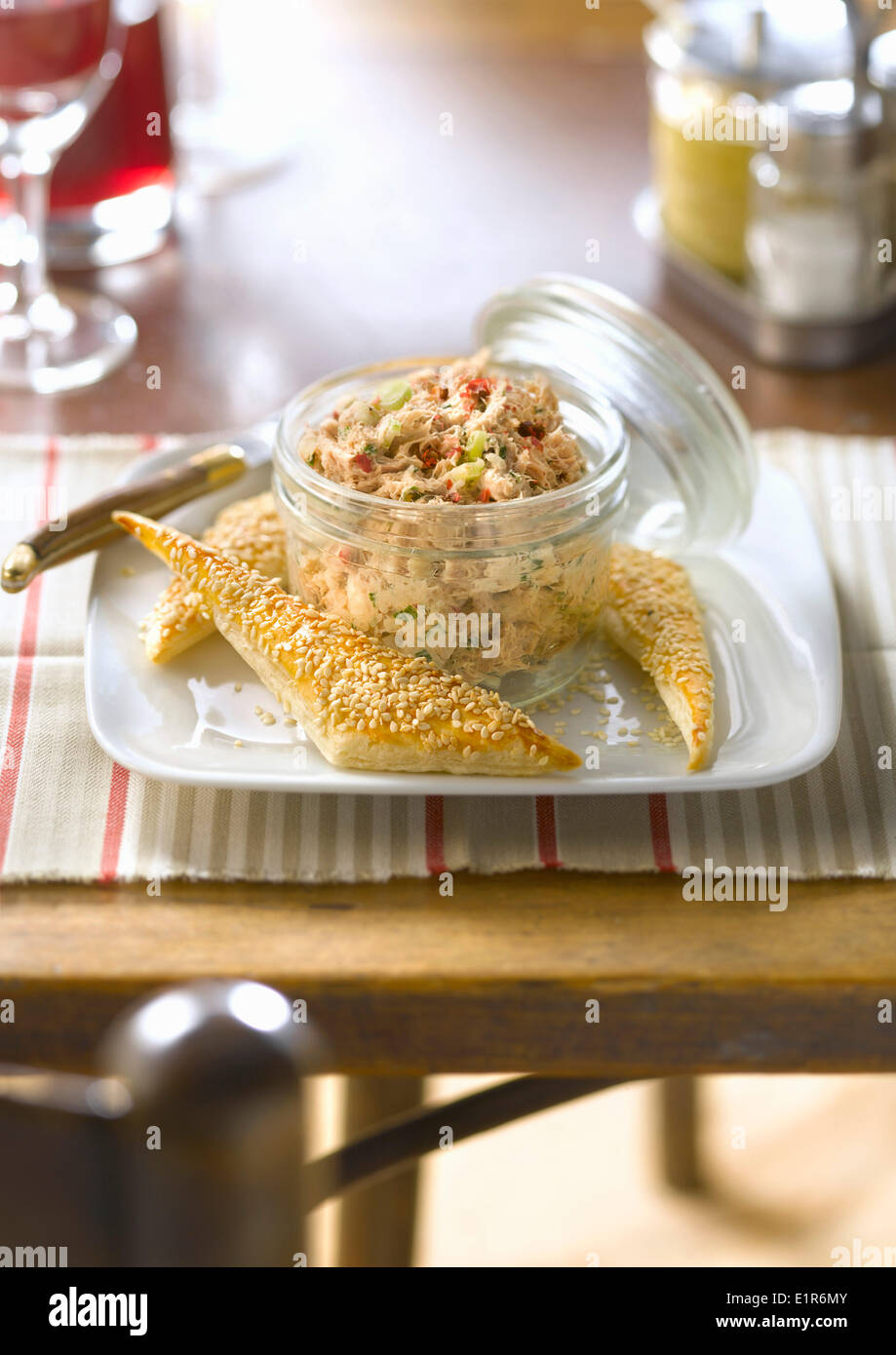 Potted tuna with flaky pastry and sesame triangles Stock Photo