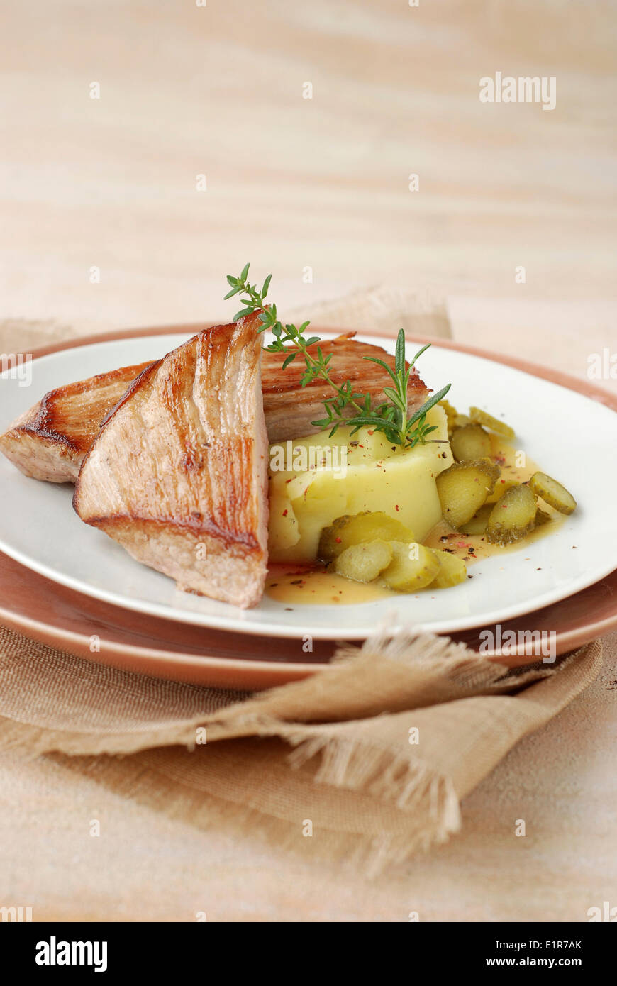 Pork escalope with Charcutiere sauce and mashed potatoes Stock Photo