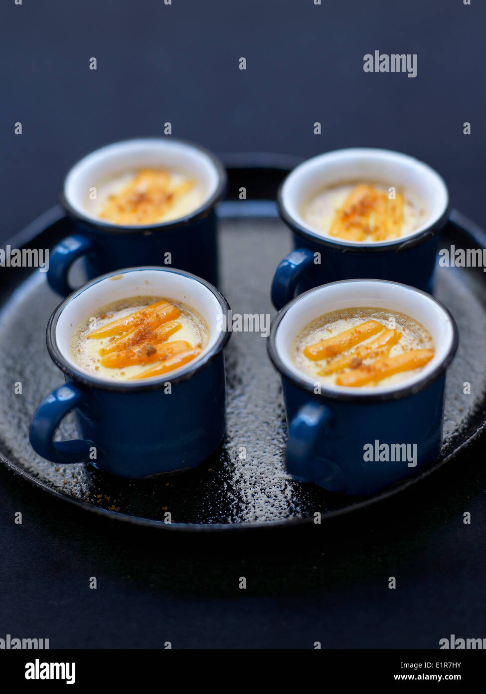Aged mimolette and Spéculos savoury baked egg custard Stock Photo