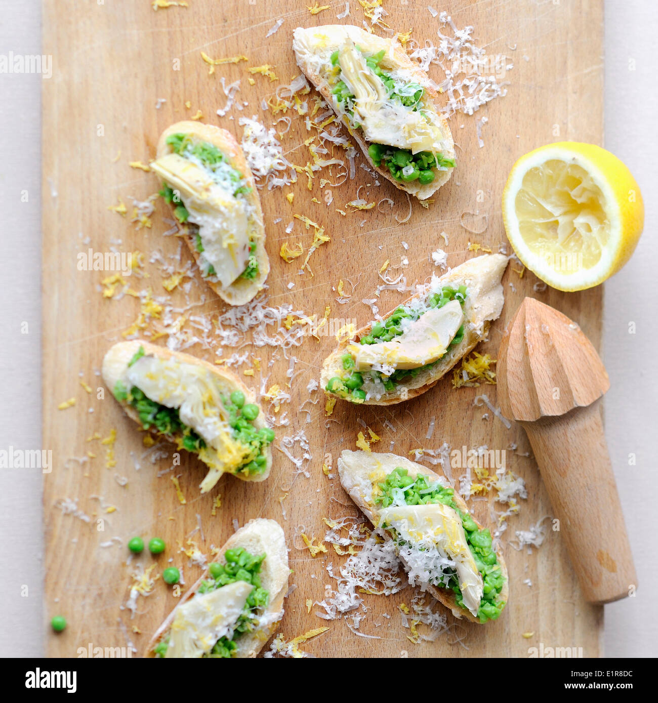Pea and artichoke bruschettas Stock Photo Alamy
