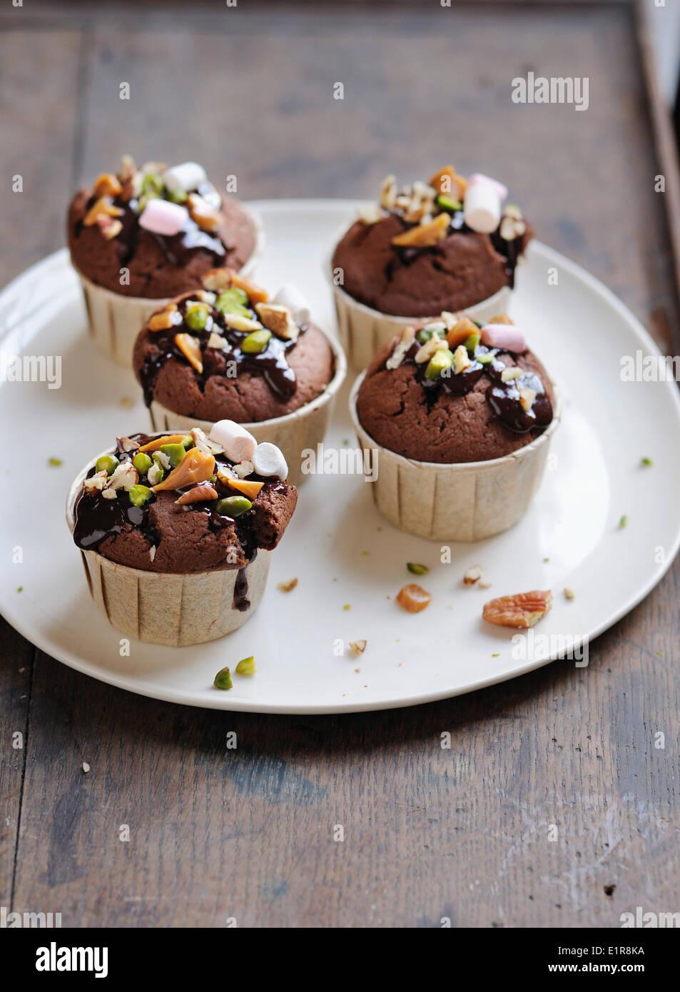 Chocolate, caramel, pistachio and marshmallow cupcakes Stock Photo Alamy