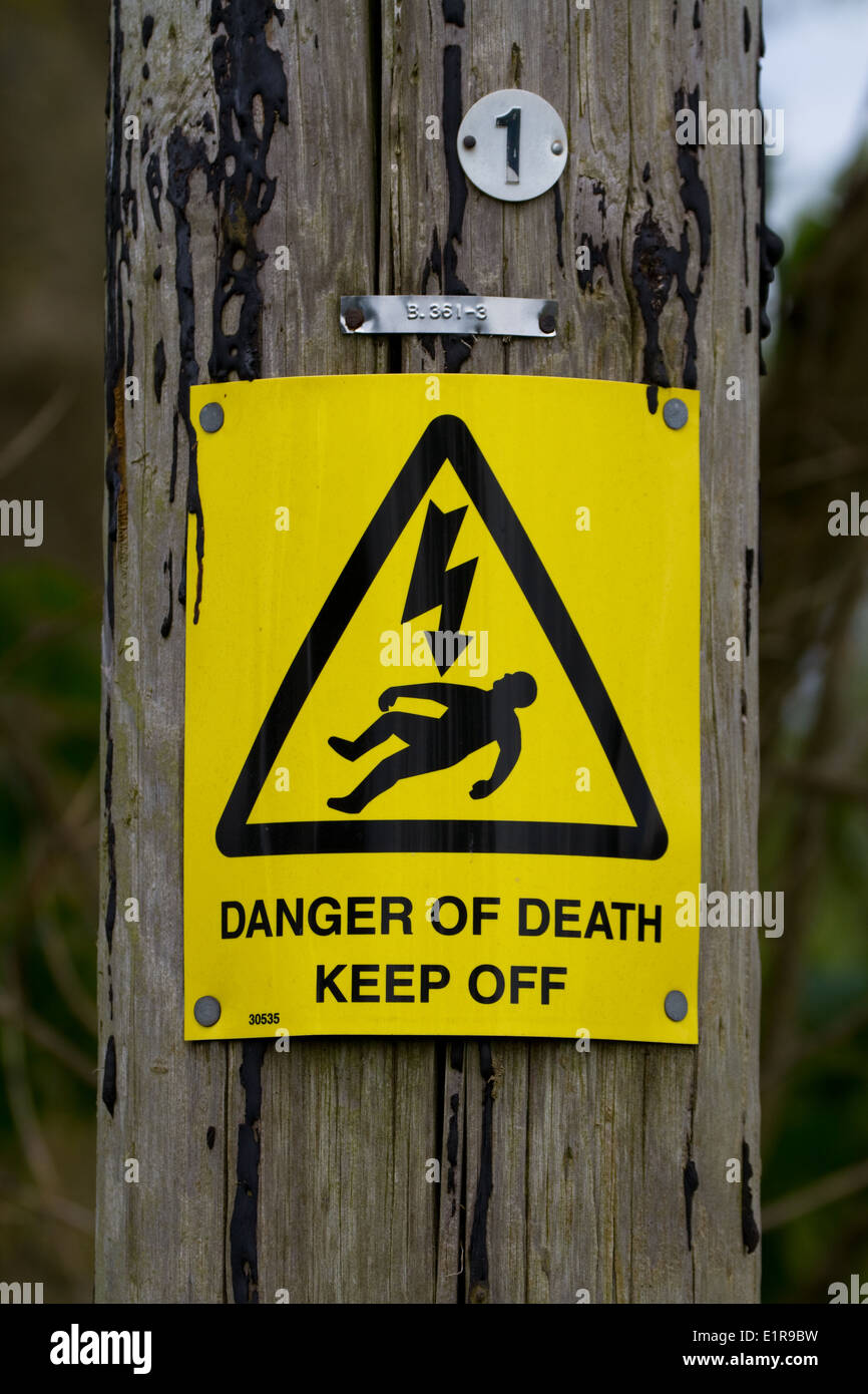 Danger of death sign on power line post. Somerset. UK Stock Photo