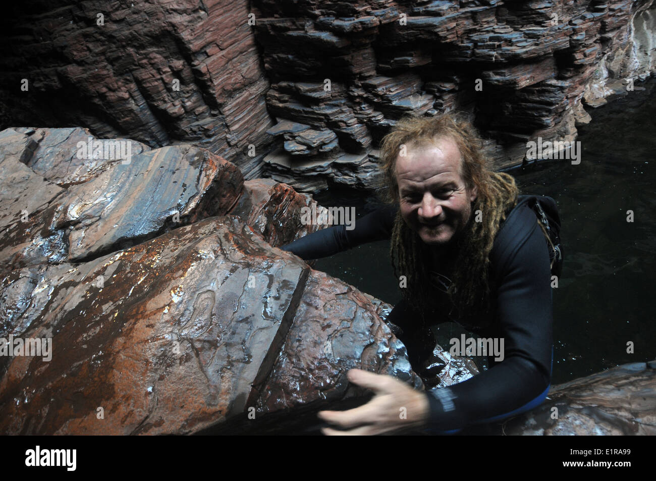 Man in wetsuit canyoning, Weano Karijini National Park, Pilbara
