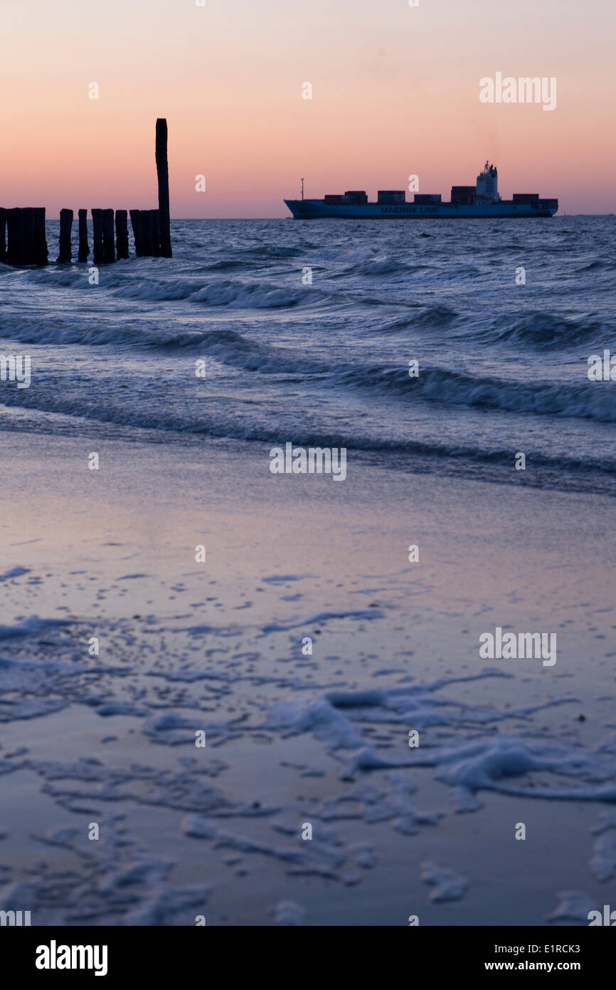 Beach of Breskens at sun set, with the mouth of the Westerschelde in the background. Stock Photo