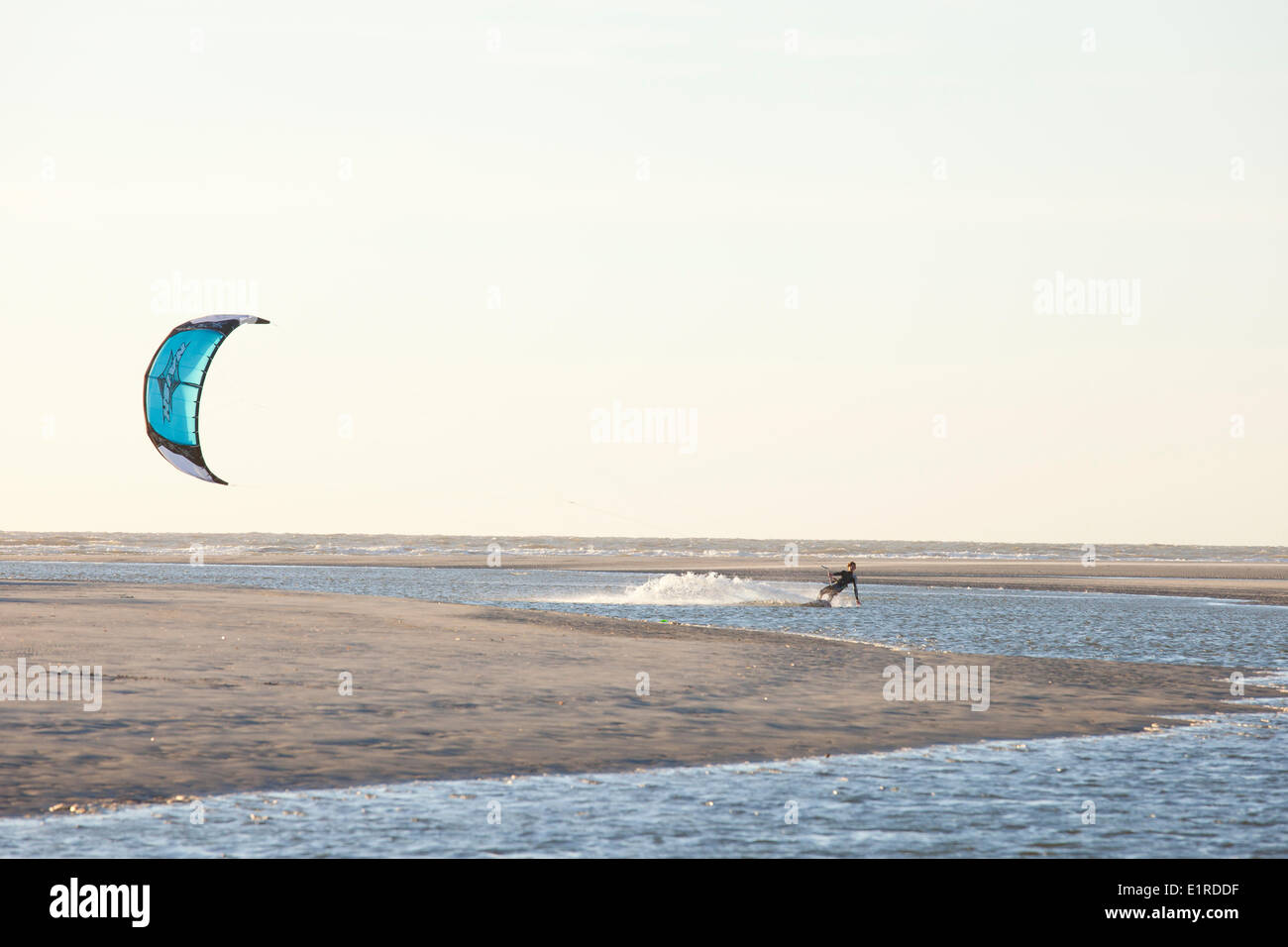 Kite surfing in the north sea near the badhotel on Schiermonnikoog. Stock Photo