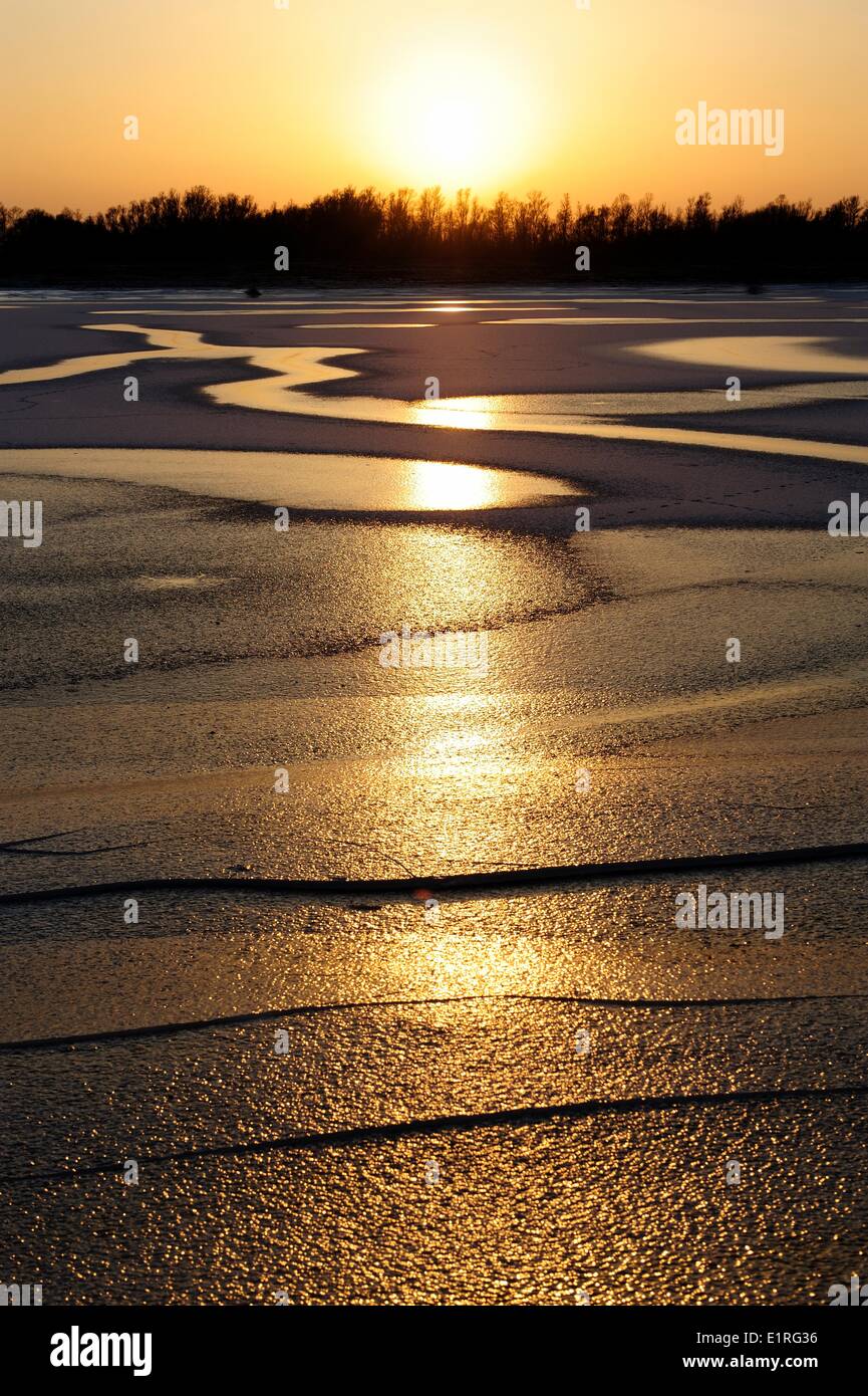 Frozen lake with evening light Stock Photo
