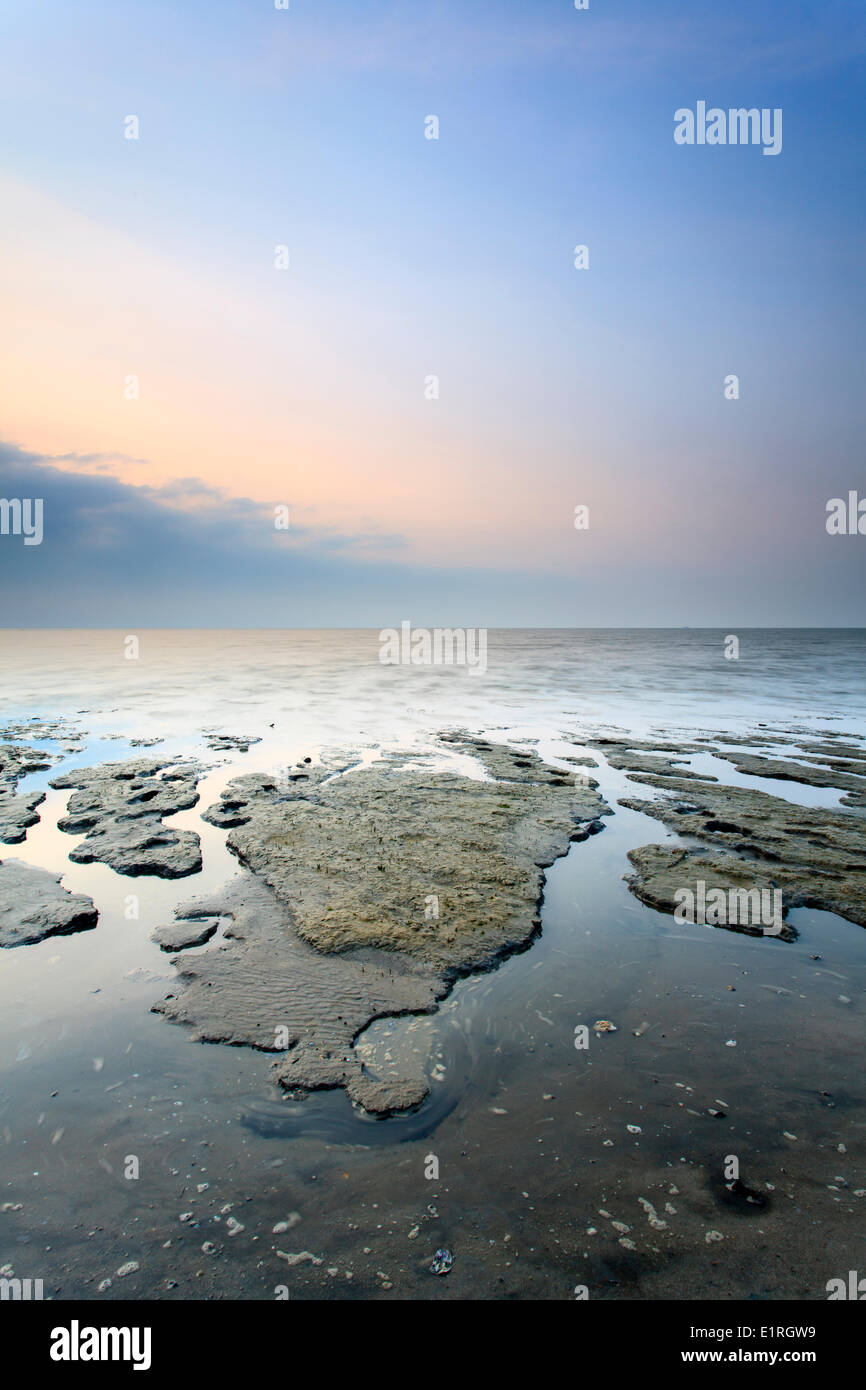 The tide creates the most beautiful shapes in the mud flats Stock Photo